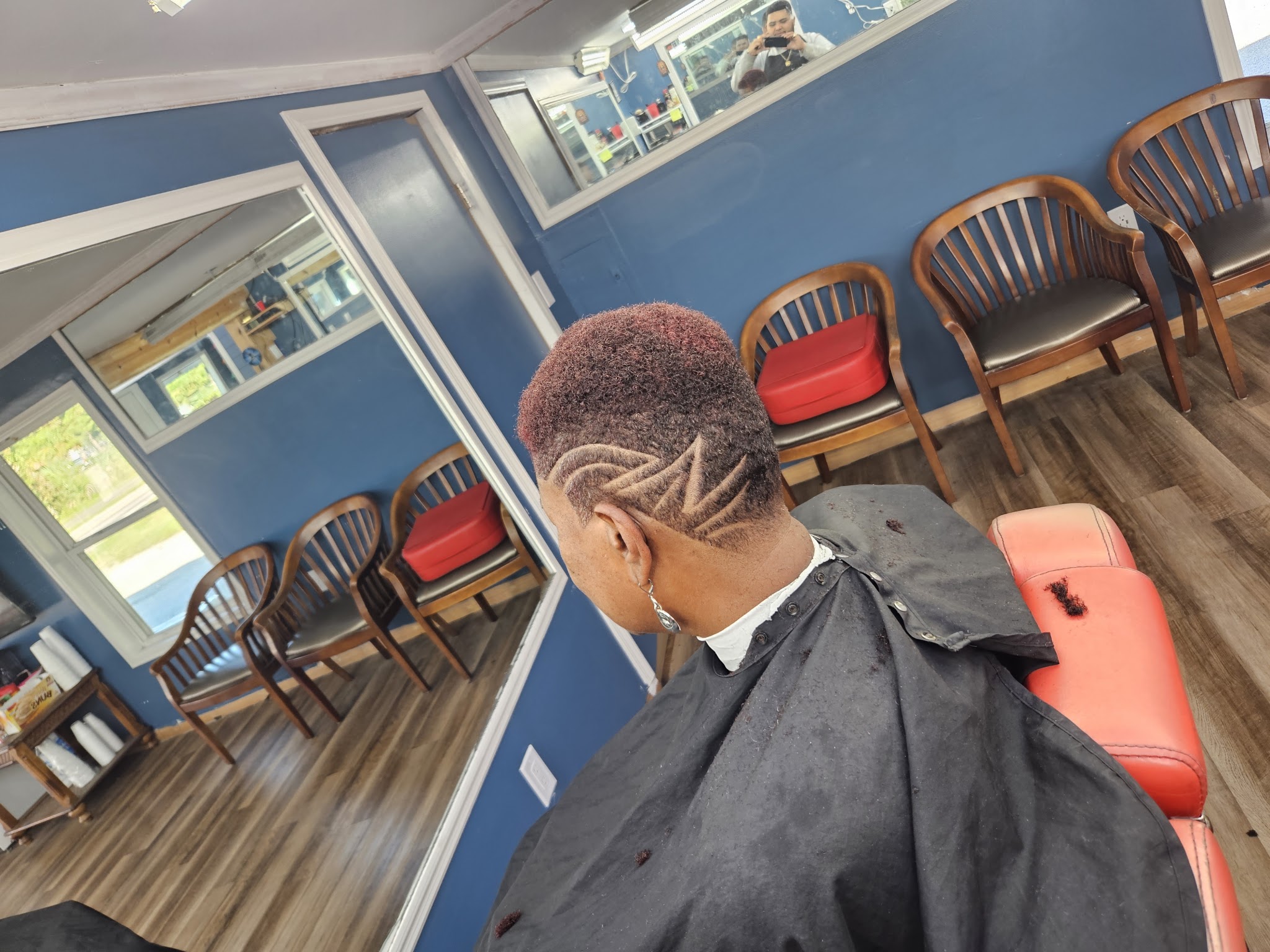 A fresh patterned fade in front of the shop's waiting chairs